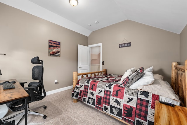 carpeted bedroom with lofted ceiling