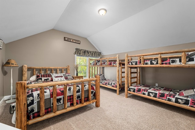 bedroom with lofted ceiling and carpet