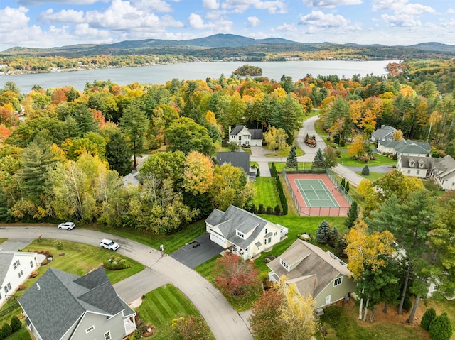 birds eye view of property with a water and mountain view