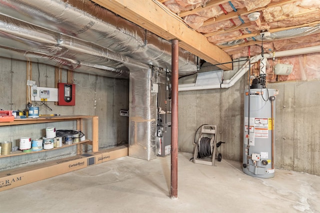 basement featuring gas water heater and heating unit