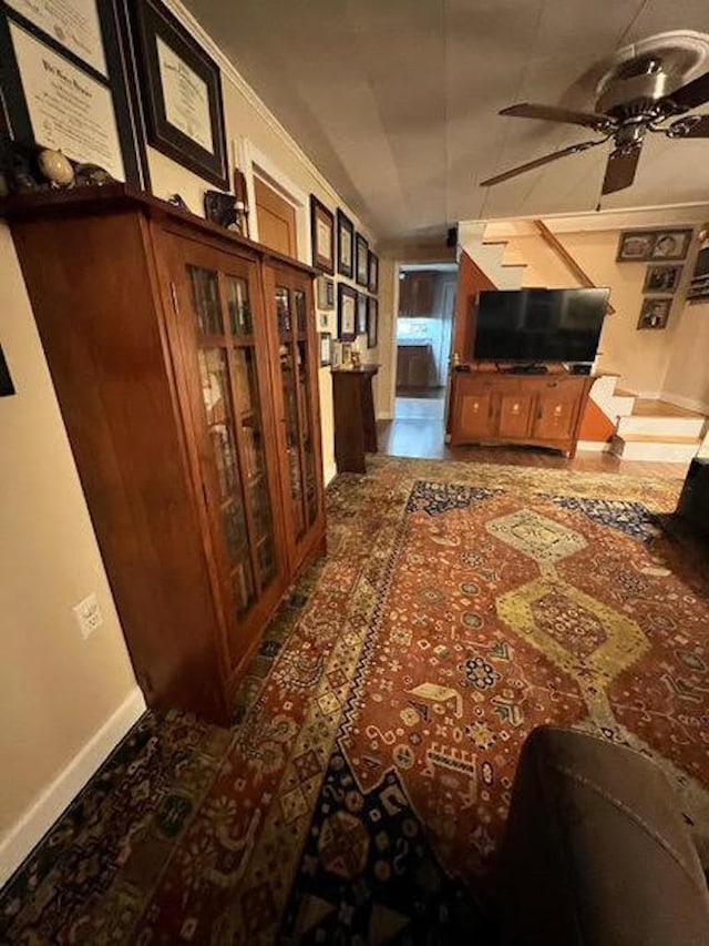 interior space featuring lofted ceiling and ceiling fan