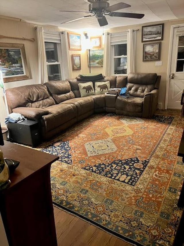 living room with ceiling fan and hardwood / wood-style floors