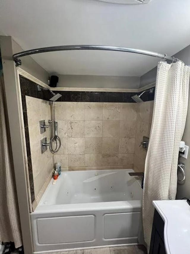 bathroom featuring vanity and shower / tub combo