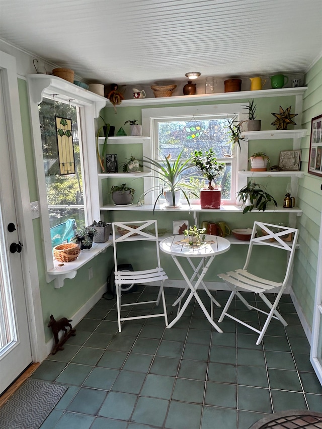 unfurnished dining area with tile patterned floors