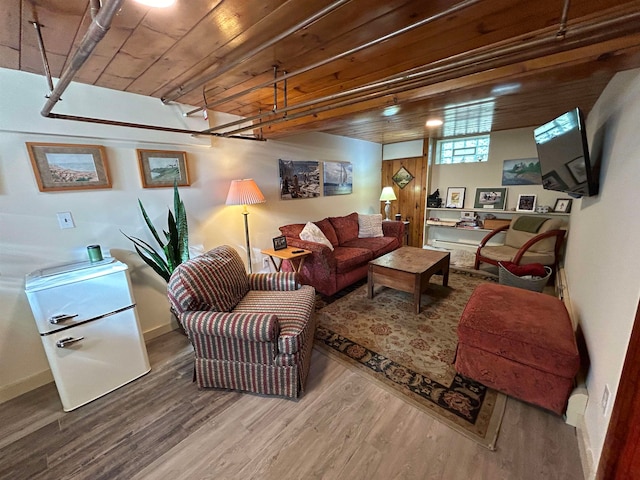 living room with wood-type flooring and wooden ceiling