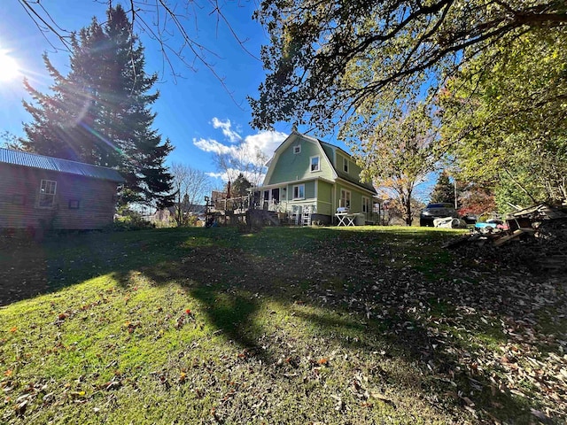 view of yard featuring a wooden deck