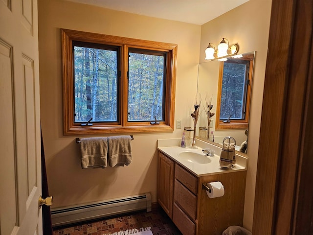 bathroom featuring vanity and a baseboard heating unit