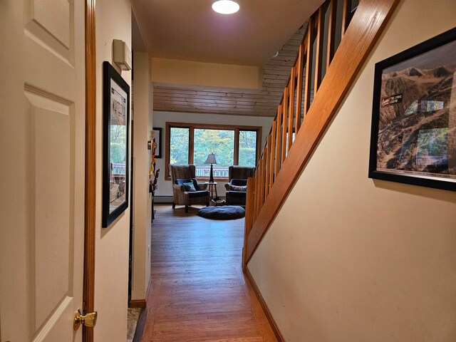 hall with dark hardwood / wood-style flooring