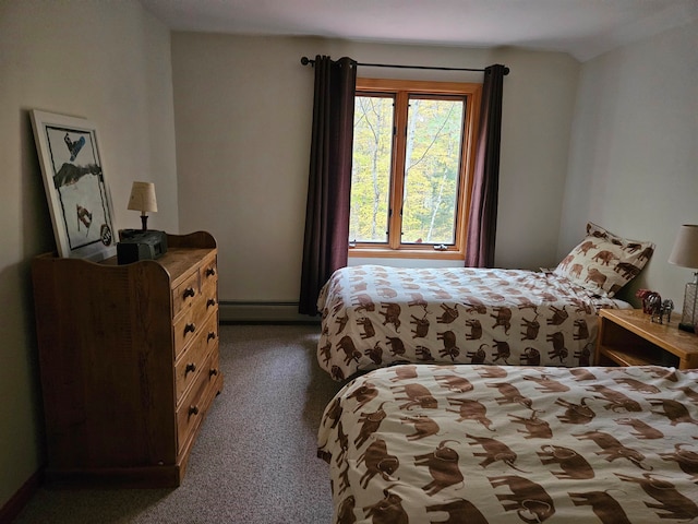 carpeted bedroom with a baseboard heating unit