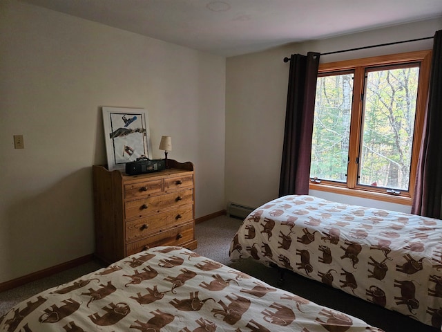 bedroom with a baseboard radiator and carpet floors