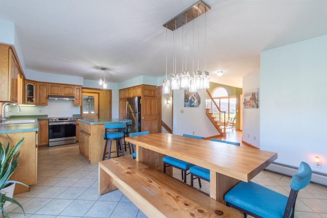 dining room with sink and light tile patterned floors