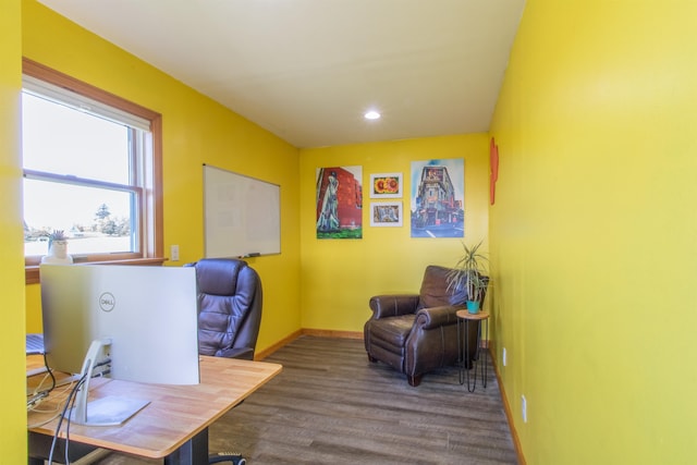 home office with dark hardwood / wood-style floors