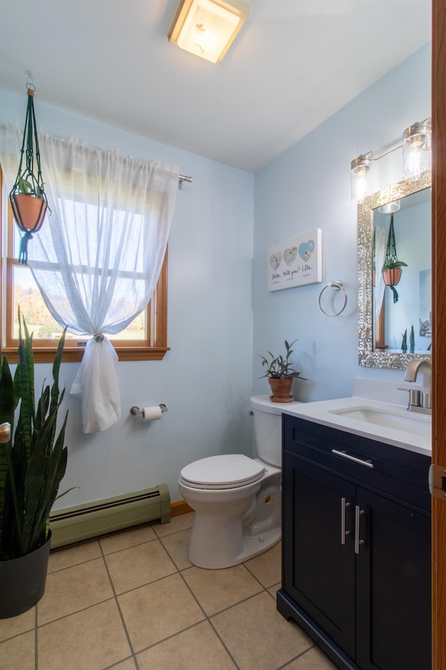 bathroom with vanity, a baseboard heating unit, toilet, and tile patterned flooring