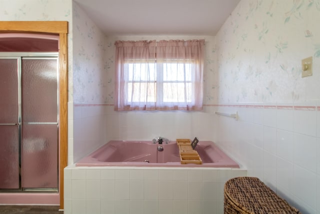 bathroom with separate shower and tub