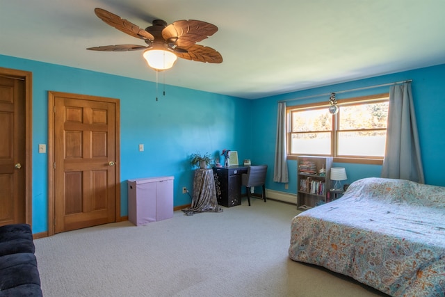 bedroom featuring ceiling fan and light carpet