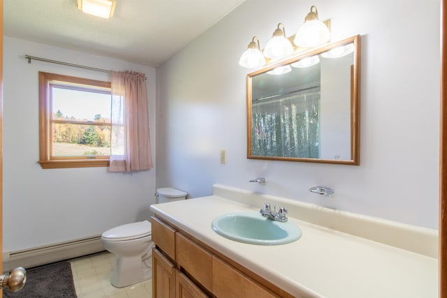 bathroom featuring vanity, a baseboard radiator, and toilet