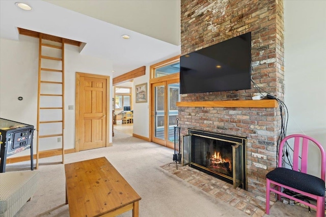 carpeted living room featuring a fireplace