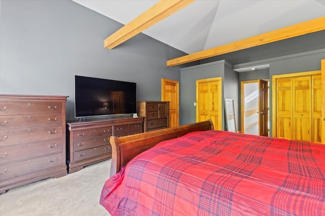 carpeted bedroom featuring a closet, beam ceiling, and high vaulted ceiling