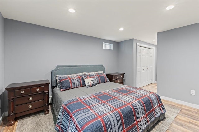 bedroom featuring a closet and light hardwood / wood-style floors