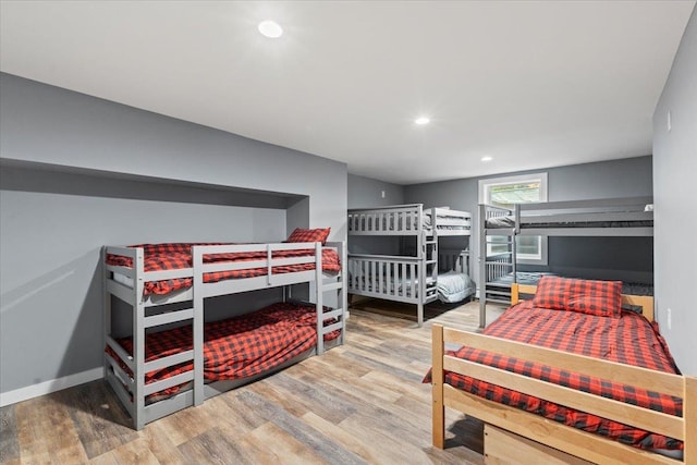 bedroom with hardwood / wood-style floors