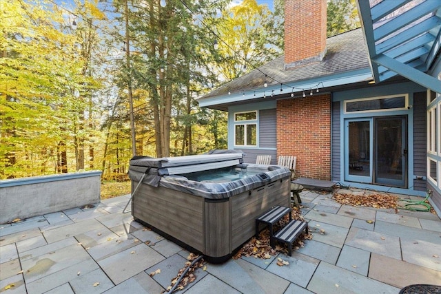 view of patio featuring a hot tub