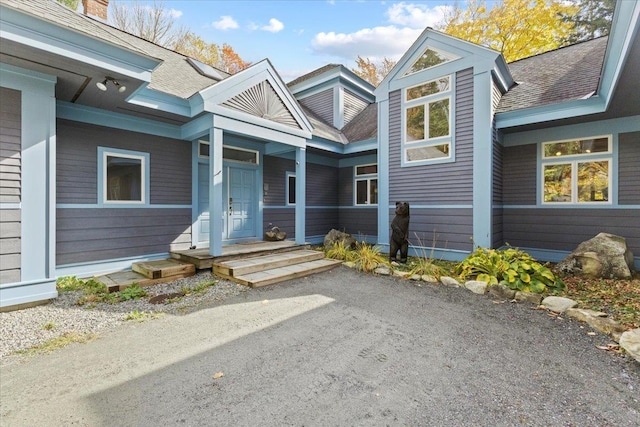 entrance to property featuring covered porch