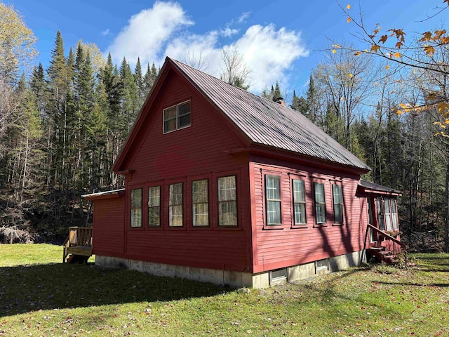 view of home's exterior with a lawn