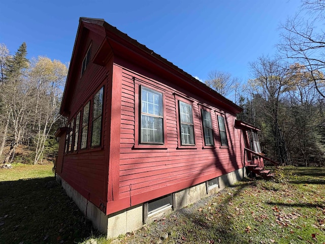 view of property exterior featuring a yard