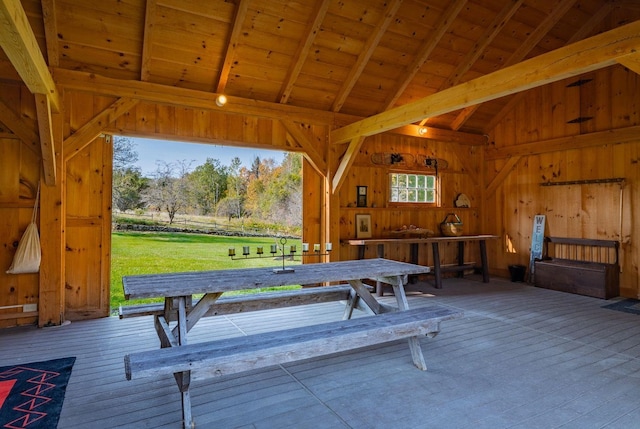 recreation room featuring wood ceiling, beamed ceiling, hardwood / wood-style floors, high vaulted ceiling, and wood walls