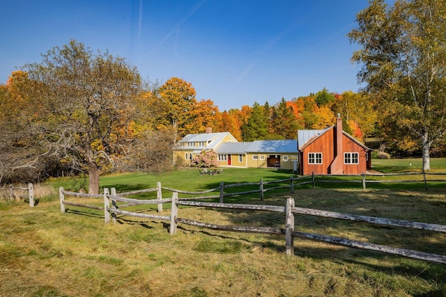 view of yard with a rural view