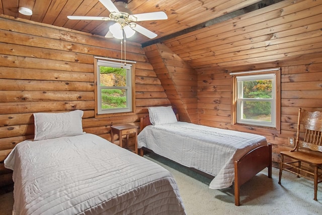 carpeted bedroom with multiple windows, lofted ceiling, wood ceiling, and ceiling fan