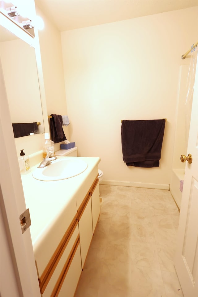 full bathroom featuring bathtub / shower combination, vanity, and toilet