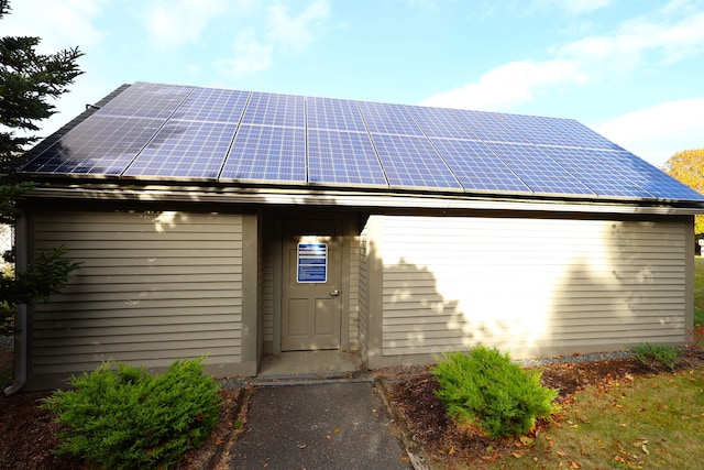 doorway to property with solar panels