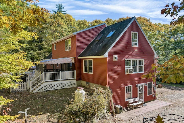 rear view of house with covered porch