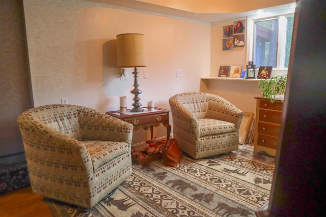 sitting room featuring hardwood / wood-style floors