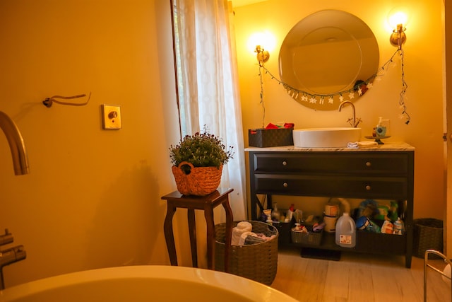 bathroom with vanity and hardwood / wood-style floors