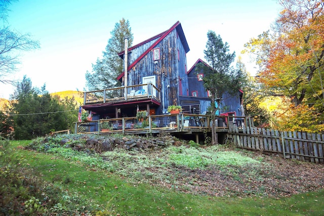 back of property featuring a deck