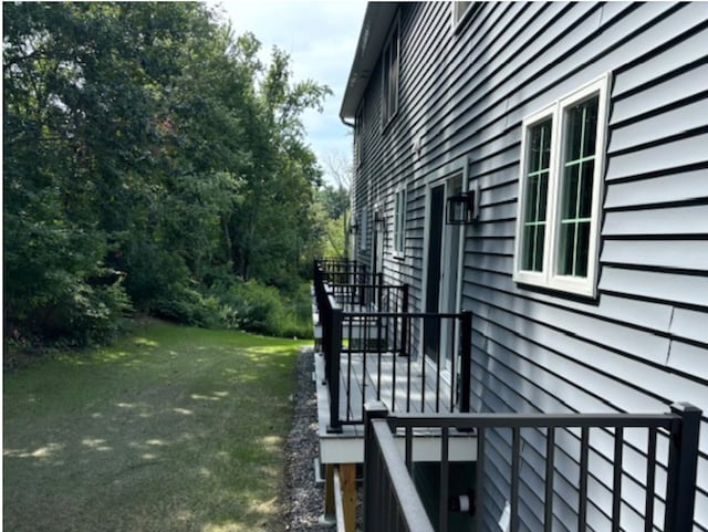 view of side of property with a yard