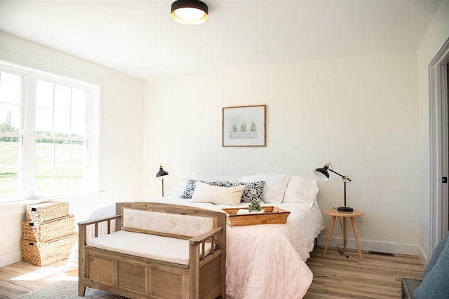 bedroom with light hardwood / wood-style floors