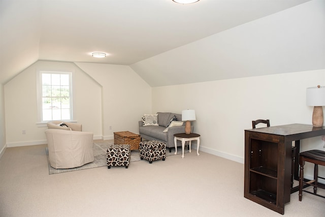 interior space featuring light colored carpet and vaulted ceiling