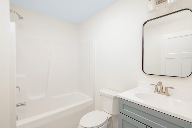 full bathroom with vanity, washtub / shower combination, and toilet