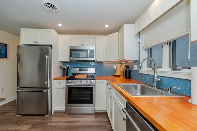 461 Ocean Blvd Unit A7, Hampton, NH 03842 - bedroom featuring light colored carpet, baseboards, ceiling fan, crown molding, and wooden ceiling