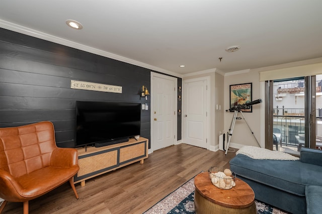 461 Ocean Blvd Unit A7, Hampton, NH 03842 - living area with ornamental molding, wood finished floors, recessed lighting, and baseboards