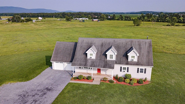 drone / aerial view featuring a rural view and a mountain view