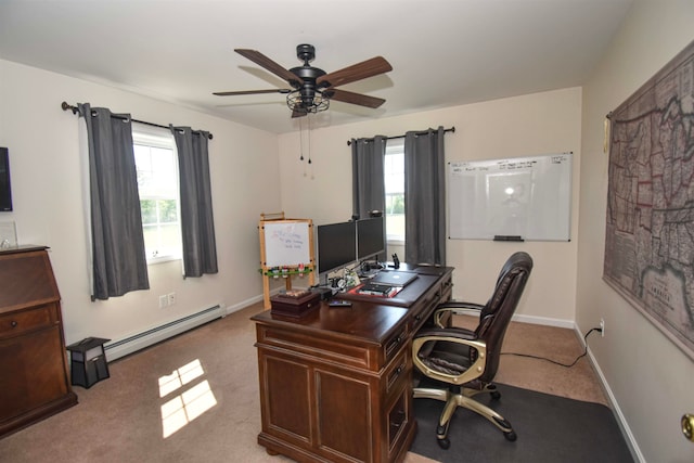 home office featuring carpet floors, ceiling fan, a baseboard radiator, and a wealth of natural light