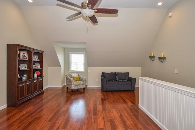 living area featuring vaulted ceiling, radiator, dark hardwood / wood-style floors, and ceiling fan