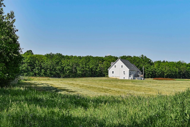 view of yard with a rural view