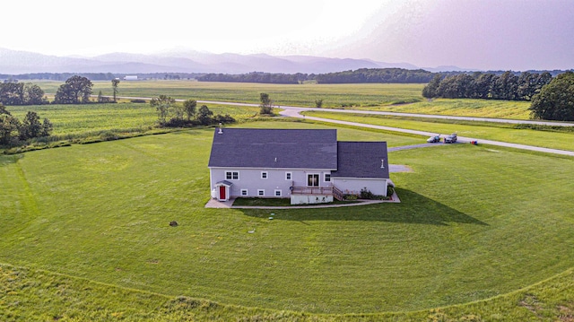 drone / aerial view featuring a mountain view and a rural view