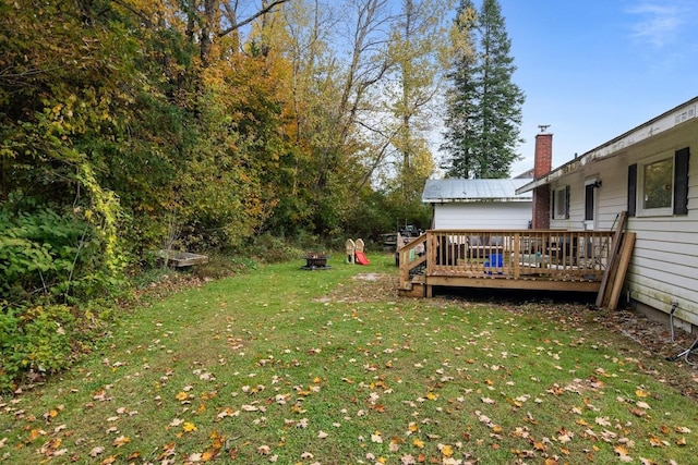 view of yard with a wooden deck