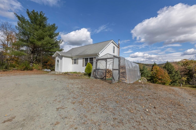 view of front facade with an outbuilding